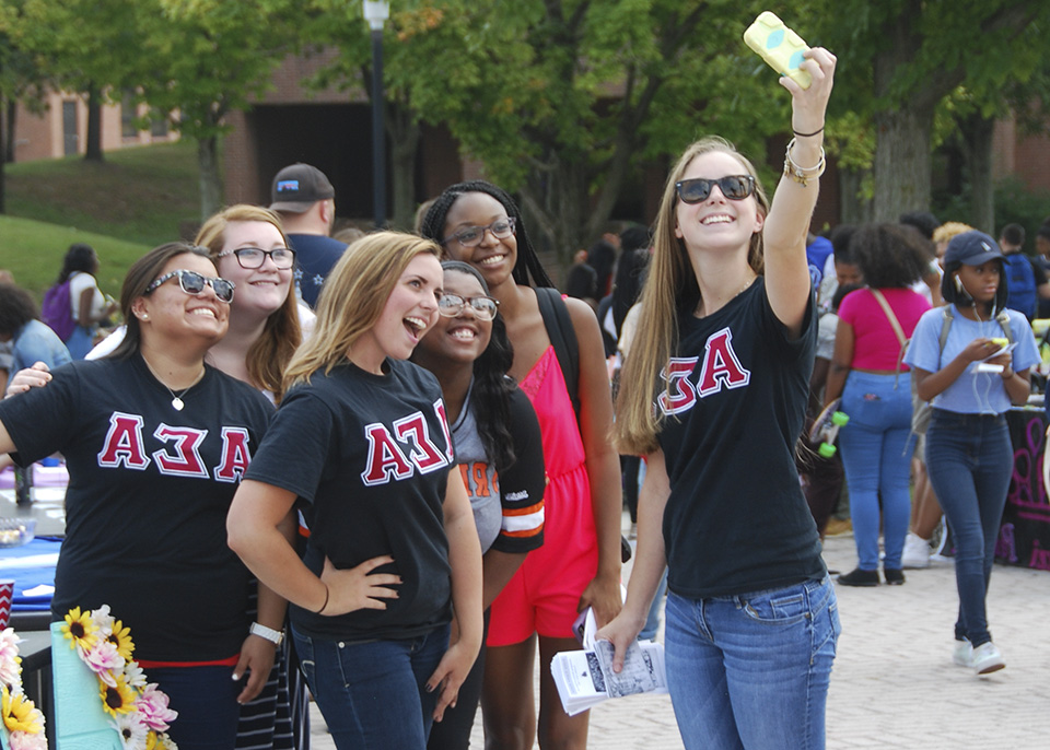 female students take selfie together